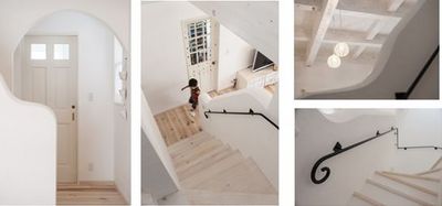 階段のＲ型の袖壁はフランス漆喰仕上げでやわらかな丸みを表現。アイアンの手すりは、もちろんオリジナル。